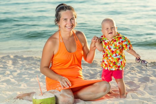 Baby and mother on the tropical beach