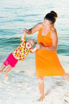 Baby and mother on the tropical beach