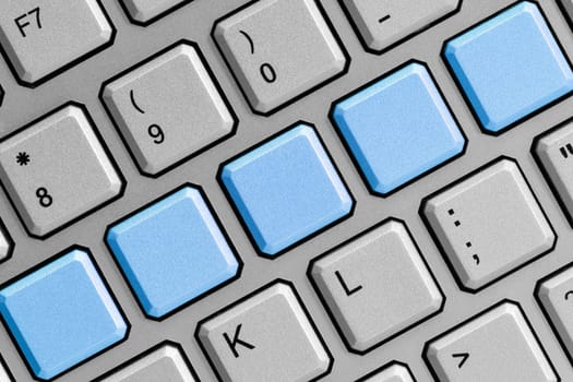 Blank blue buttons on the keyboard close-up