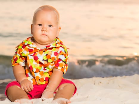 Cute baby on the tropical beach