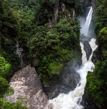 Paílón del Diablo - Mountain river and waterfall in the Andes. Banos. Ecuador