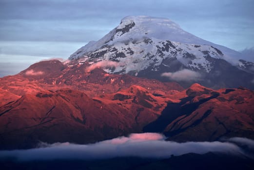 Sunset on the Volcano Cayambe, Cordillera Oriental, a branch of the Ecuadorian Andes. It is located in Pichincha province some 70 km (43 mi) northeast of Quito. It is the third highest mountain in Ecuador, South America