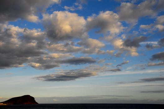 Cloudscape, Colored Clouds at Sunset near the Ocean
