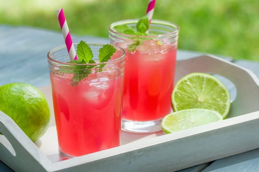 Two glasses of ice-cooled lemonade