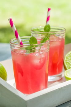 Two glasses of ice-cooled lemonade