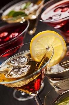 Party cocktails and longdrinks garnished with fruits for summer