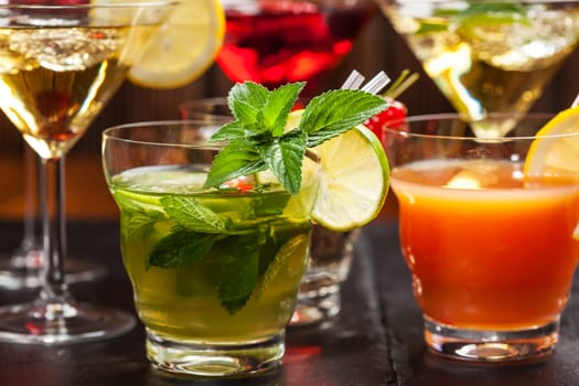 Party cocktails and longdrinks garnished with fruits for summer