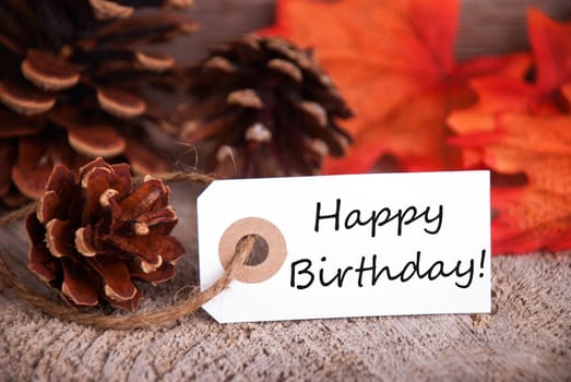 Fall Background with a Label with Happy Birthday on it