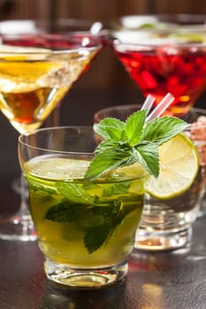 Party cocktails and longdrinks garnished with fruits for summer