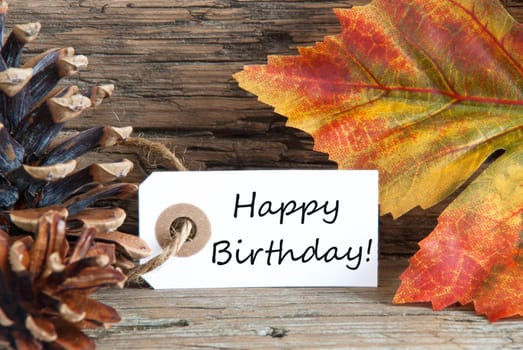 Autumn or Fall Background with a Label with Happy Birthday on it