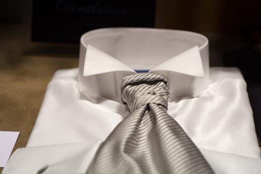 Close up of white male shirts exposed in the clothes shop