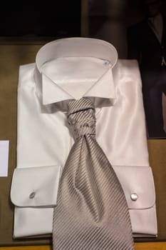 Close up of white male shirts exposed in the clothes shop