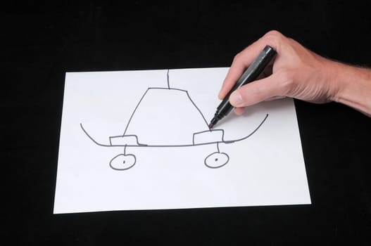 A Caucasian Male Hand Drawing on a White Paper