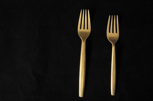 Ancient Vintage Silver Flatware on a Black Background