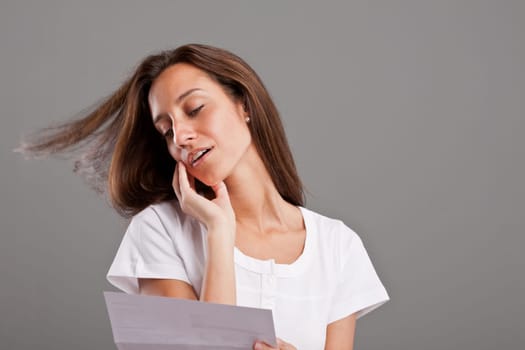 a young woman reading a love letter