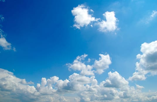 blue sky background with tiny clouds