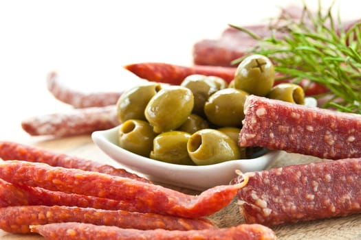 Antipasti on board with salami and olives