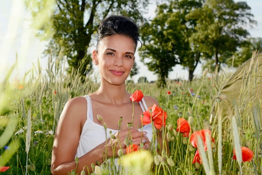 young woman with poppy flower