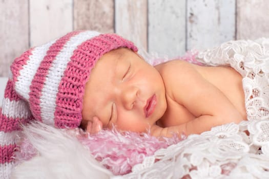 little baby with pink beanie
