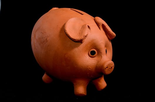 Ceramic Pink Piggy Bank isolated on a Black Backgriund