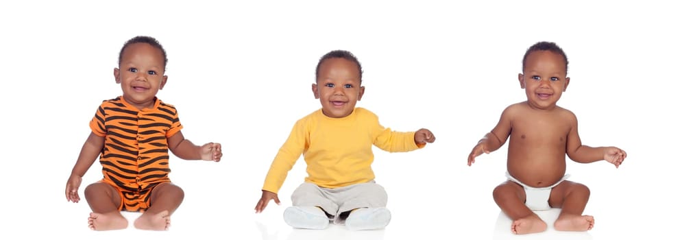 Three equal african babies with differents clothes isolated on white background
