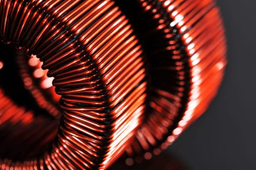 Macro detail of two copper coils of a transformer