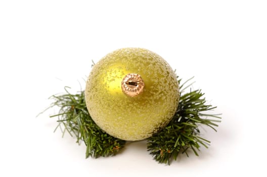Green Christmas bauble with a twig