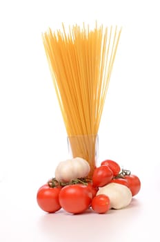 Spaghetti with tomatoes on a wooden table