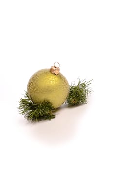 Green Christmas bauble with a twig