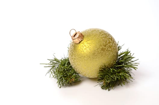 Green Christmas bauble with a twig