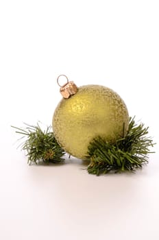 Green Christmas bauble with a twig