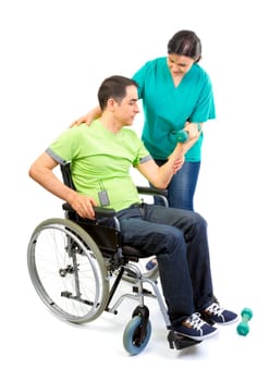 Physical therapist works with patient in lifting hands weights. Young adult in wheelchair.