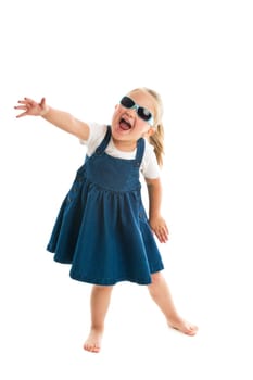 dancing little girl. studio shot