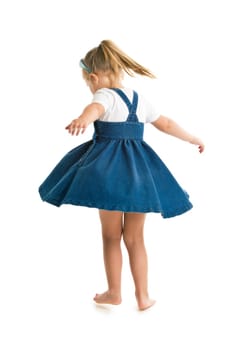 dancing little girl. studio shot