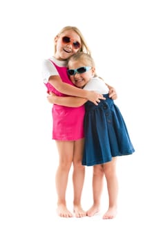 two happy little sisters isolated on white