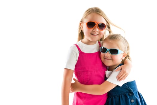 two happy little sisters isolated on white
