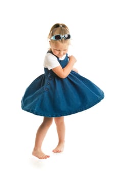 dancing little girl. studio shot