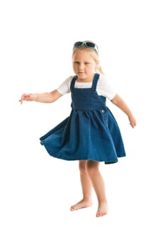 dancing little girl. studio shot