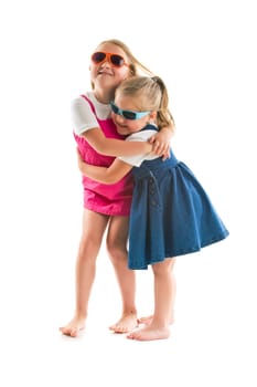 two happy little sisters isolated on white