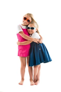 two happy little sisters isolated on white