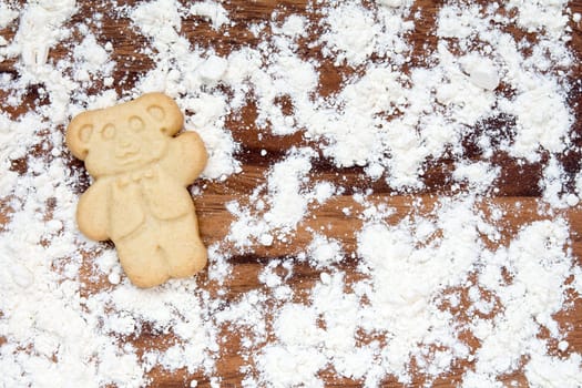 Cookie bear with flour on a cutting board