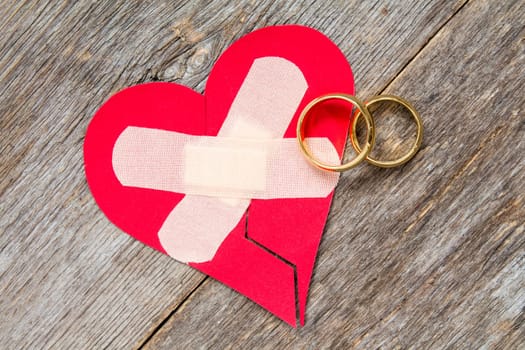 Wedding rings and heart fixed with plaster
