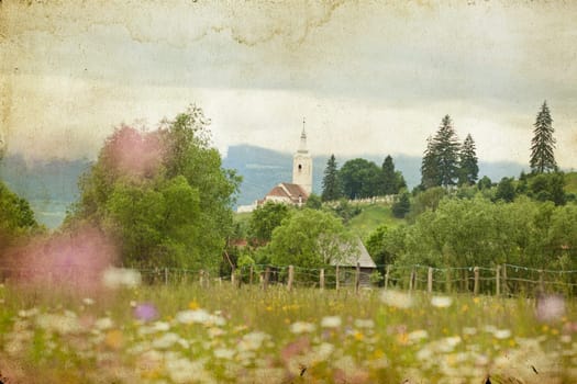 Old house in the mountains on the field