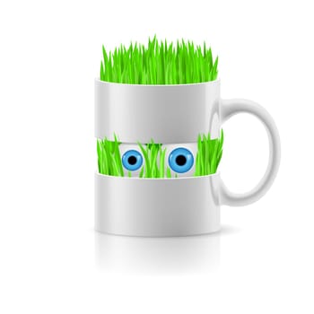 White mug divided into two parts with grass and two eyes inside.