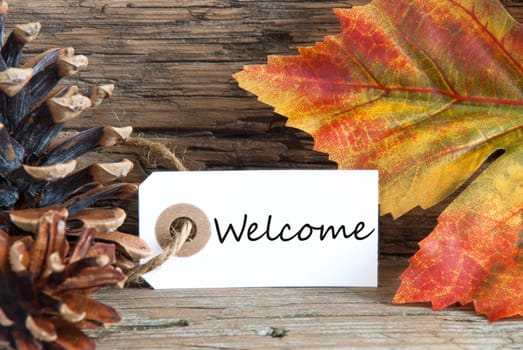 Autumn Background with the Word Welcome written on a label