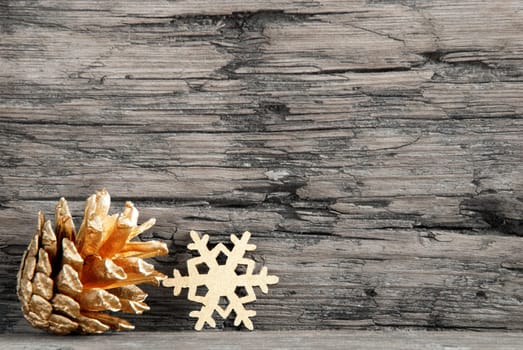 Golden Christmas Decoration on a Wooden Black and White Board with Copy Space for Your Text