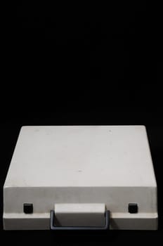 An Old Travel Vintage Typewriter Cover on a Black Background