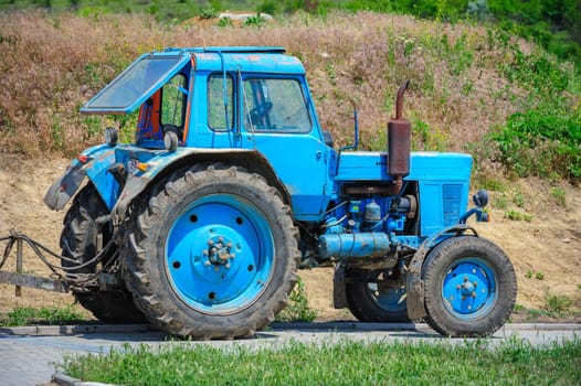 old agriculture tractor outdoors ready for work at field