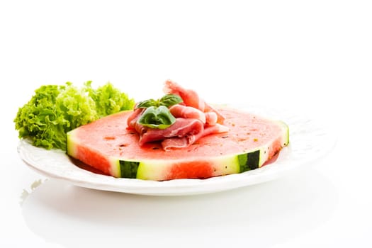 Watermelon with Parma ham and basil