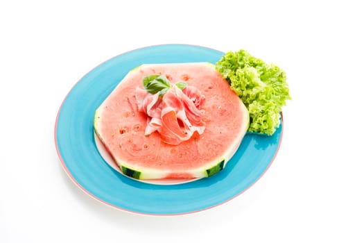 Watermelon with Parma ham and basil
